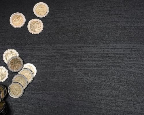 Gold Round Coins on Black Textile